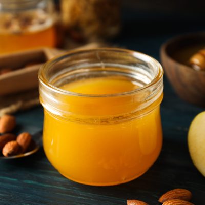 Concept of tasty and sweet food - honey with nuts