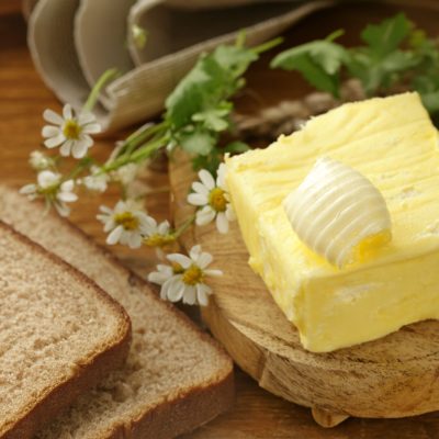 organic dairy product butter on wooden background